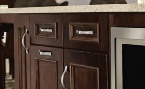 dark wood cabinets with brushed nickel hardware handles