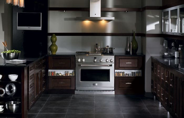 remodeled kitchen with dark, matte finishes on materials, cabinets, and appliance
