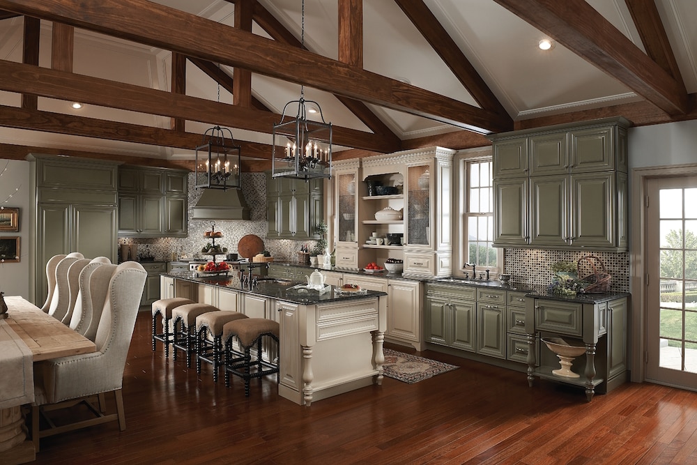 remodeled kitchen with exposed beams and kraftmaid cabinetry painted in two tones