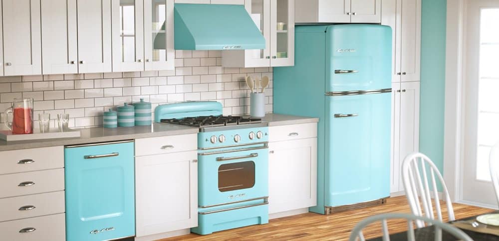 remodeled kitchen with white cabinets and subway tile backsplash, grey countertops, and turquoise retro appliances